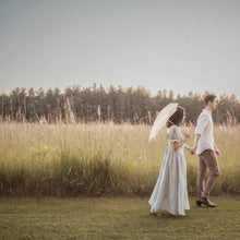 Load image into Gallery viewer, Couple enjoying a romantic walk to a proposal
